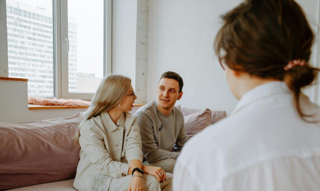 couple smiling in marriage counseling