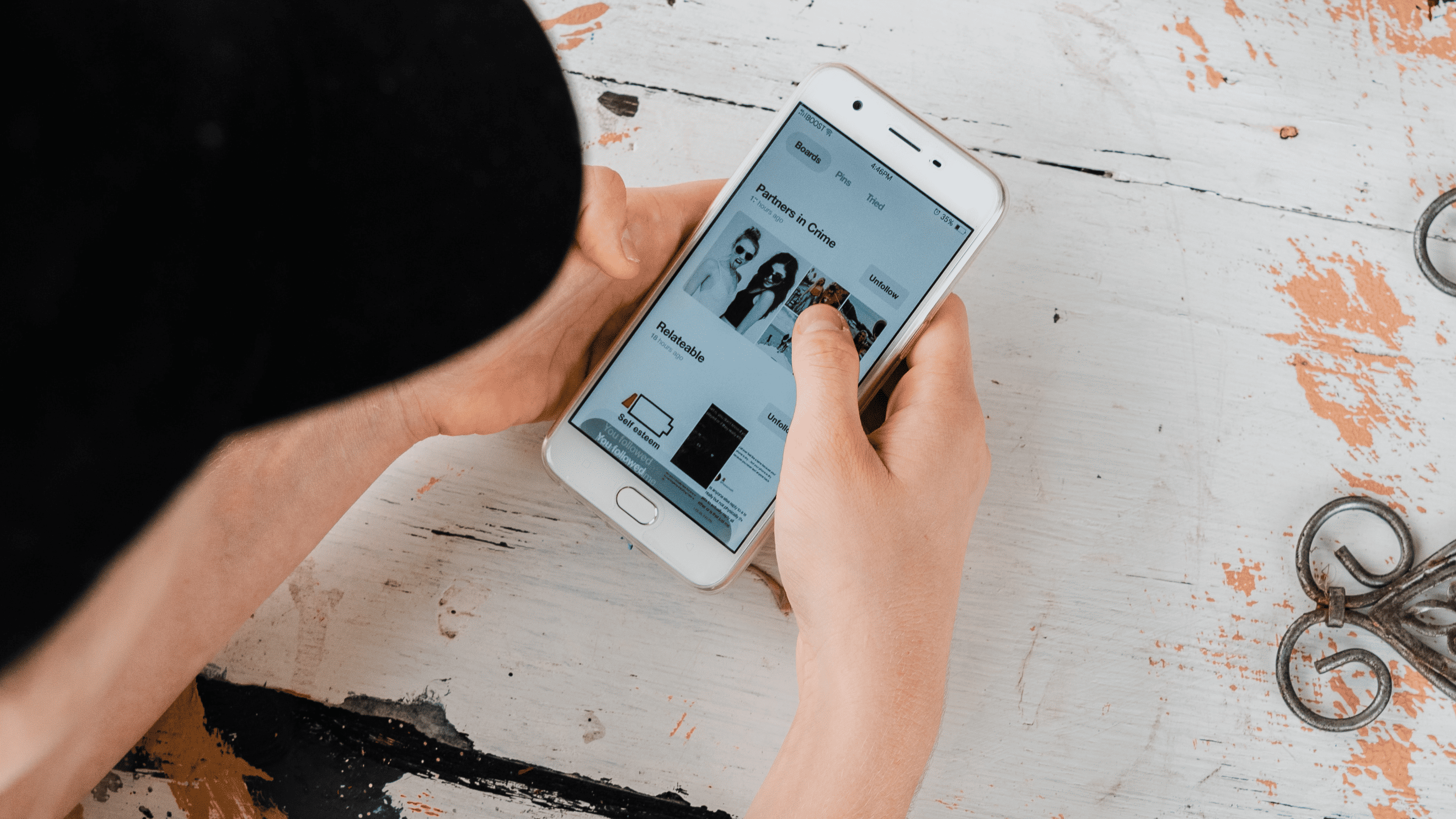 A woman checks her mobile hone